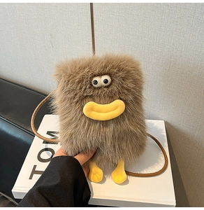 Close-up of the plush brown cartoon bag with fluffy texture and cute large eye details
