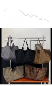 Collection of large leopard print and solid color suede tote bags in various autumn shades