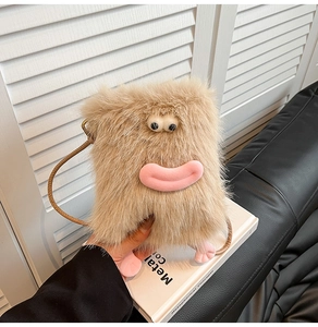 Detail of cute monster plush phone bag with pink lips and soft brown faux fur texture