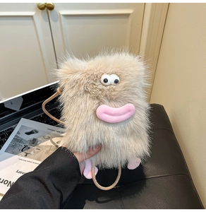 Detail of cute beige monster plush crossbody bag with pink lips and furry texture