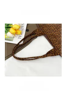Detailed close-up of the leopard print tote bag widened handle for comfortable carrying