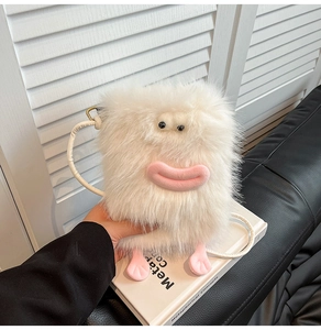 Detail of white plush monster crossbody bag featuring big eyes and pink lips