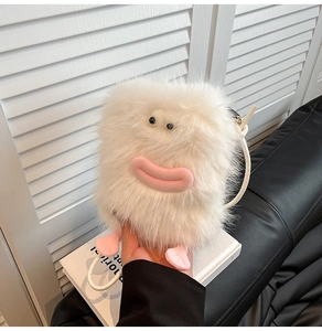 Close-up of white plush crossbody bag with cartoon face features and pink feet