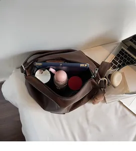 Spacious interior of dark brown vintage tote bag showing large storage capacity