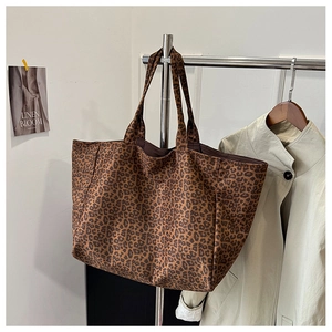 Leopard print tote bag hanging with stylish trench coat background for autumn daily look