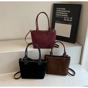 Minimalist bucket bags in burgundy, black and dark coffee suede with knotted handles