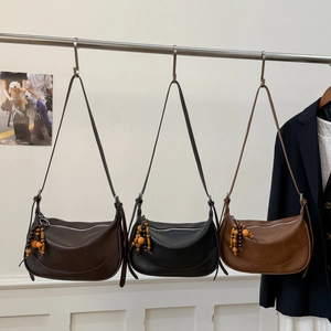 Chic solid color half-moon crossbody bags in brown and black matte leather