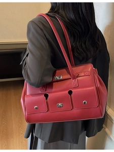 Vintage red leather tote bag with three front flap pockets and silver twist lock detail