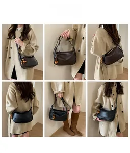Detailed multi-angle view of half-moon shoulder bags with beaded pendants and grain leather