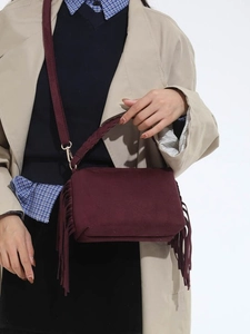 Vintage burgundy suede crossbody pillow bag with tassels and braided top handle