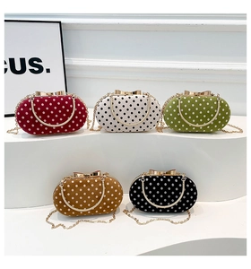 Polka dot evening clutch bags with gold metal handles and chains in five classic colors