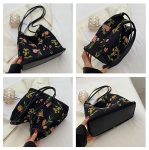 Detail shots of black canvas tote bag featuring vibrant floral embroidery and reinforced base