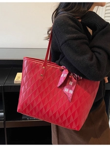 Red quilted leather tote bag with festive silk scarf detail and large capacity