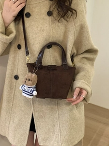Chic dark brown vintage crossbody bucket bag with cute dog pendant and premium suede finish
