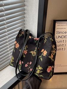 Floral embroidered black canvas bucket bag with large capacity and vintage shoulder straps
