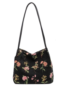Retro black canvas bucket bag with colorful floral embroidery and leather shoulder strap