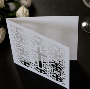 Elegant white laser-cut cross wedding invitation card with floral hollow pattern