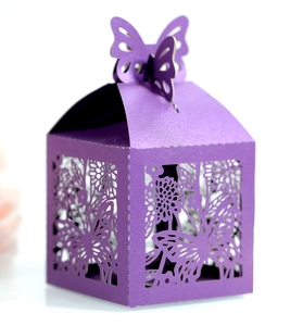 Elegant purple laser-cut wedding candy box with intricate butterfly and floral patterns