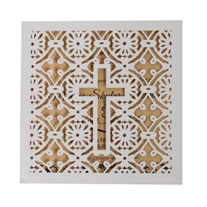 Elegant white laser-cut wedding invitation with ornate cross design and inner card