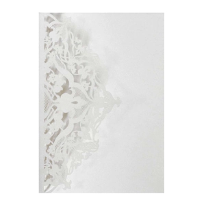 Close-up of white laser-cut card featuring intricate floral hollow-out patterns and lace details