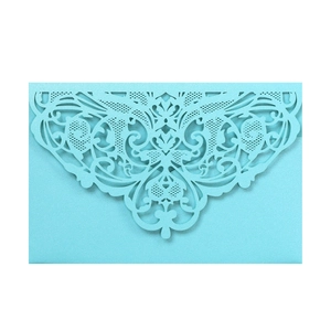 Elegant laser-cut lace invitation in sky blue pearlescent paper with ornate patterns
