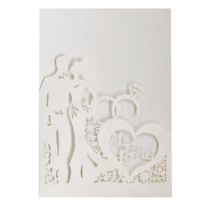 Detail of laser-cut wedding invitation featuring Mr & Mrs silhouettes and ring design