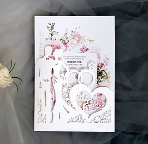 Laser-cut wedding invitation featuring Mr & Mrs silhouette and pink floral inner card