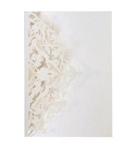 Close-up of laser-cut lace details and Baroque floral patterns on a white invitation card