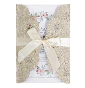Champagne gold laser cut rose wedding invitation with cream satin ribbon and floral insert