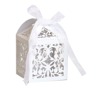 Detailed laser-cut hollow lace gift box in white cardstock with a silk ribbon bow