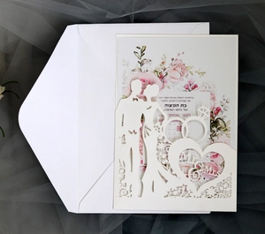 Elegant laser cut wedding invitation with Mr & Mrs silhouette and pink floral background