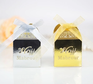 Detail of Hajj Mabrour hollow candy boxes with mirror finish, ribbons and laser-cut patterns