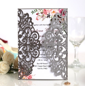 Laser-cut wedding invitation featuring silver glitter geometric hollow shell and floral inner