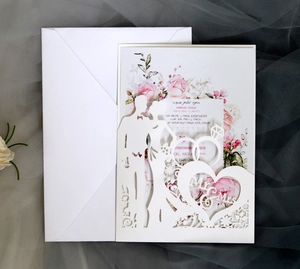 Elegant laser-cut wedding invitation featuring Mr & Mrs heart silhouette and white envelope