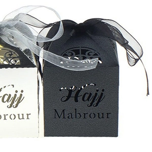 Close-up of laser-cut Hajj Mabrour hollow candy box with texture and organza ribbon