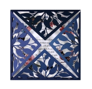 Navy blue laser cut wedding invitation with elegant floral lace pattern and inner card
