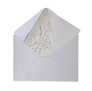 Elegant white laser-cut wedding invitation set with floral lace design and envelope