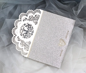 Elegant silver glitter wedding invitation with cream hollow lace cover and laser cut heart