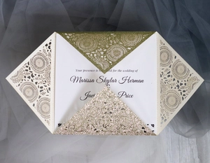 Laser cut wedding invitation with gold glitter and cream tri-fold hollow design