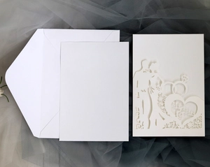 Detailed laser cut wedding invitation with Mr & Mrs silhouette and white envelope