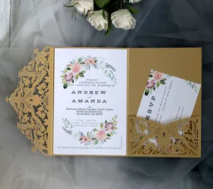 Detail of laser cut champagne gold lace wedding invitation with elegant floral inner page