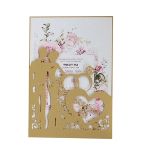 Detail of laser-cut gold wedding invitation with Mr & Mrs text and floral inner card