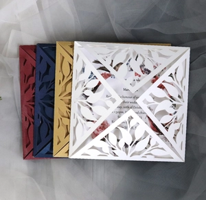 Detailed laser-cut leaf pattern on wedding invitation cards in multiple elegant colors