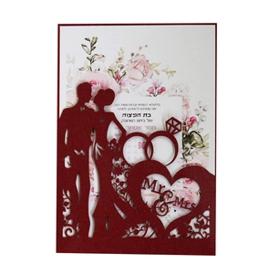 Laser-cut red wedding card featuring Mr & Mrs silhouette and elegant floral inner page