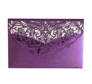 Detail of purple laser-cut lace wedding invitation with pearlized paper texture
