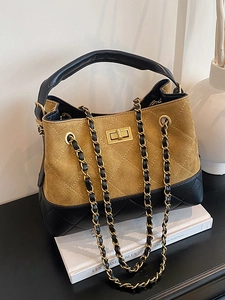 Large capacity bucket bag with yellow suede and black quilted leather with chain