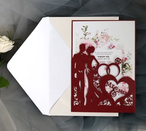 Detail of red laser cut wedding invitation with Mr & Mrs silhouette and white rose