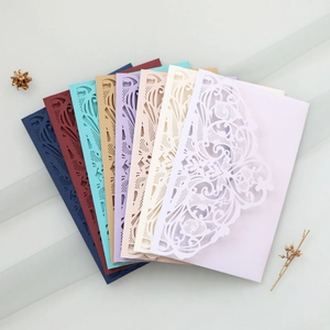 Detail of laser-cut floral lace invitation cards in eight elegant assorted colors