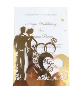 Detailed laser cut wedding invitation card with gold foil rings and heart silhouette
