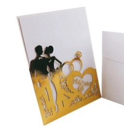 Laser cut wedding invitation with golden Mr & Mrs heart silhouette and white envelope